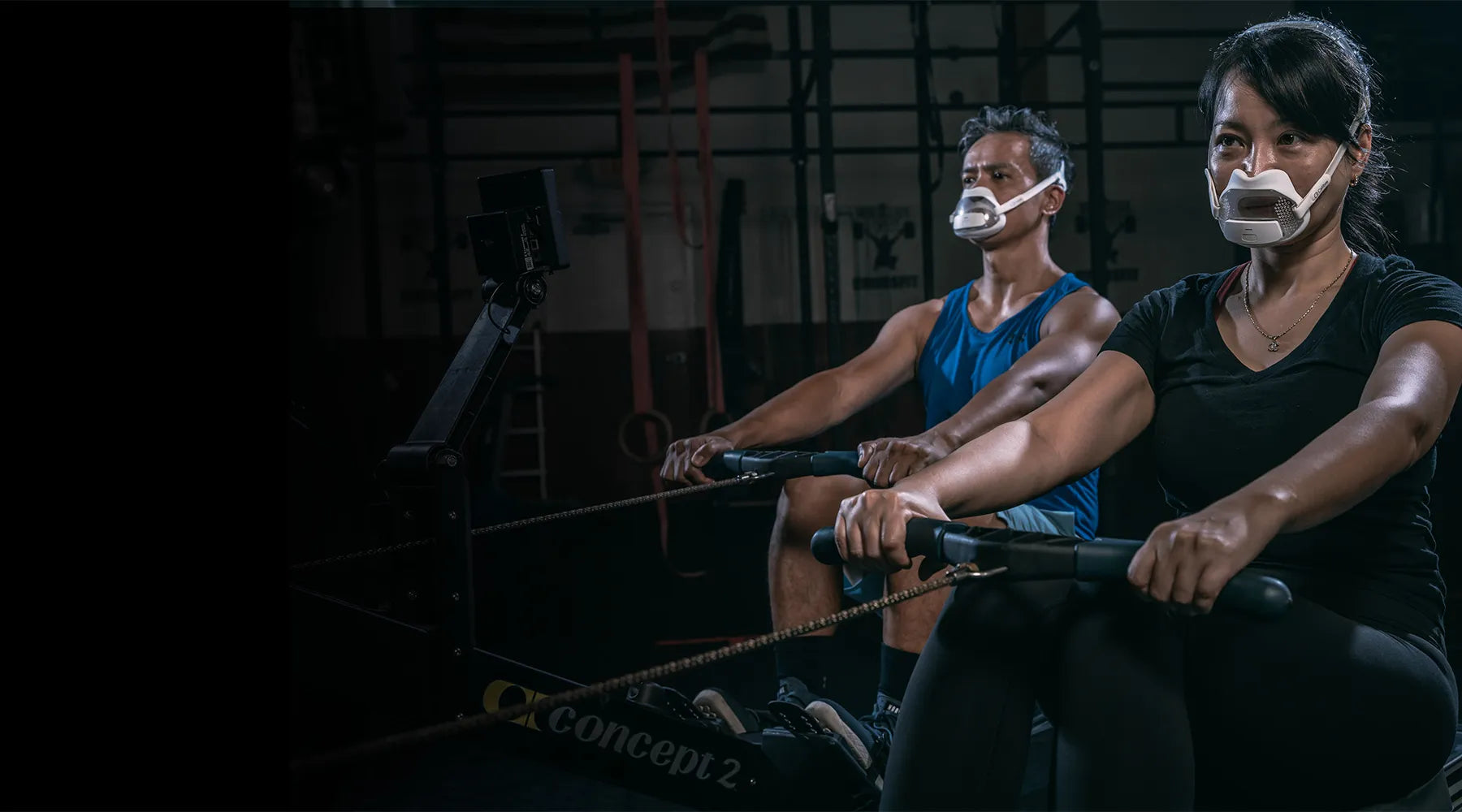Two athletes using Calibre Breath Tracker while Rowing